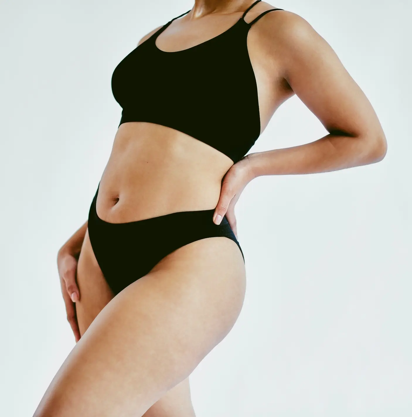Natural body, underwear and woman in studio with gray background and copy space. Closeup of empowerment, young and beautiful girl with body positive and self love mindset embracing beauty of her skin Breast Lift in Daytona Beach, FL