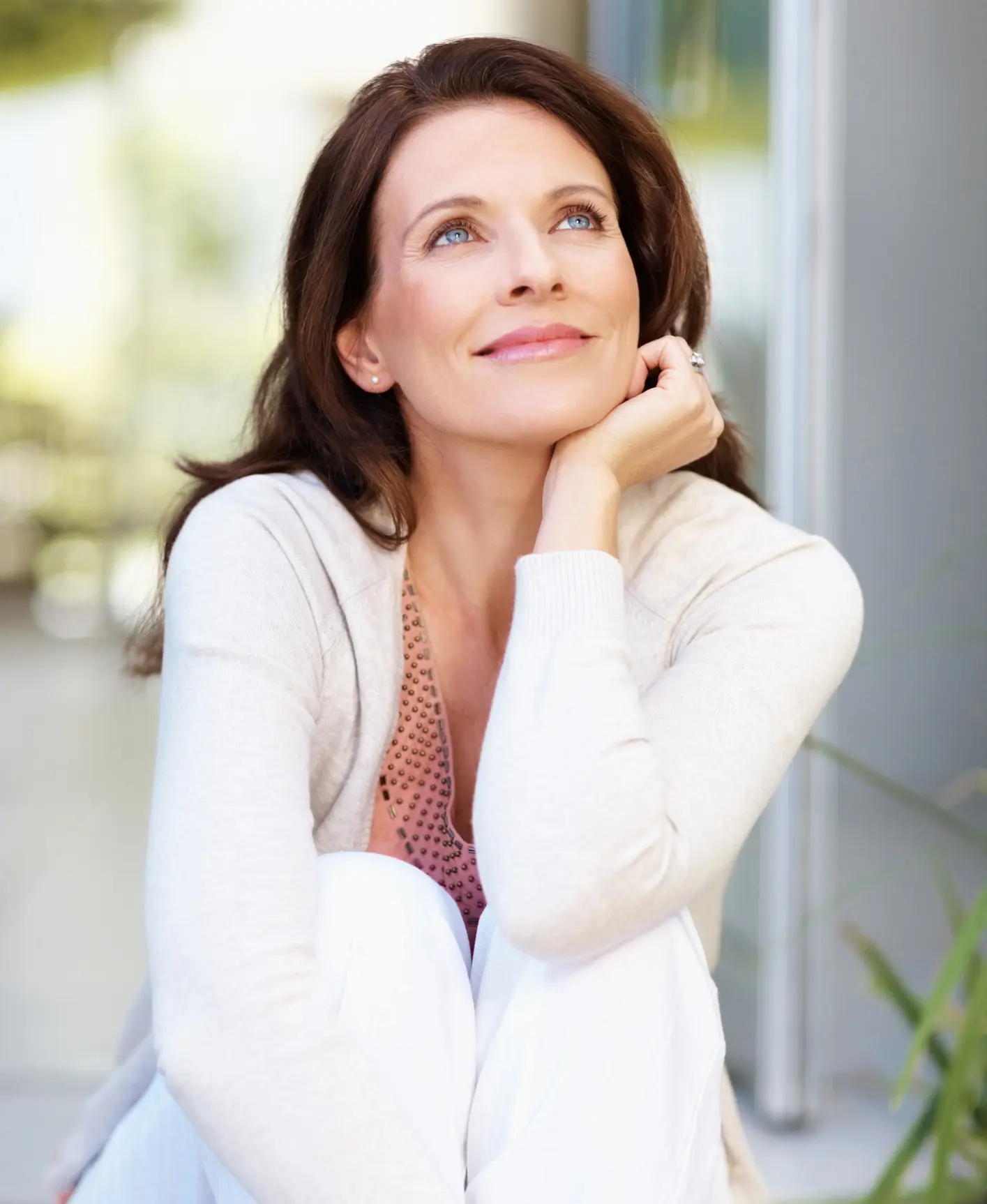 Smiling mature lady looking up Cosmetic Breast Surgery and Enhancement in Daytona Beach, FL