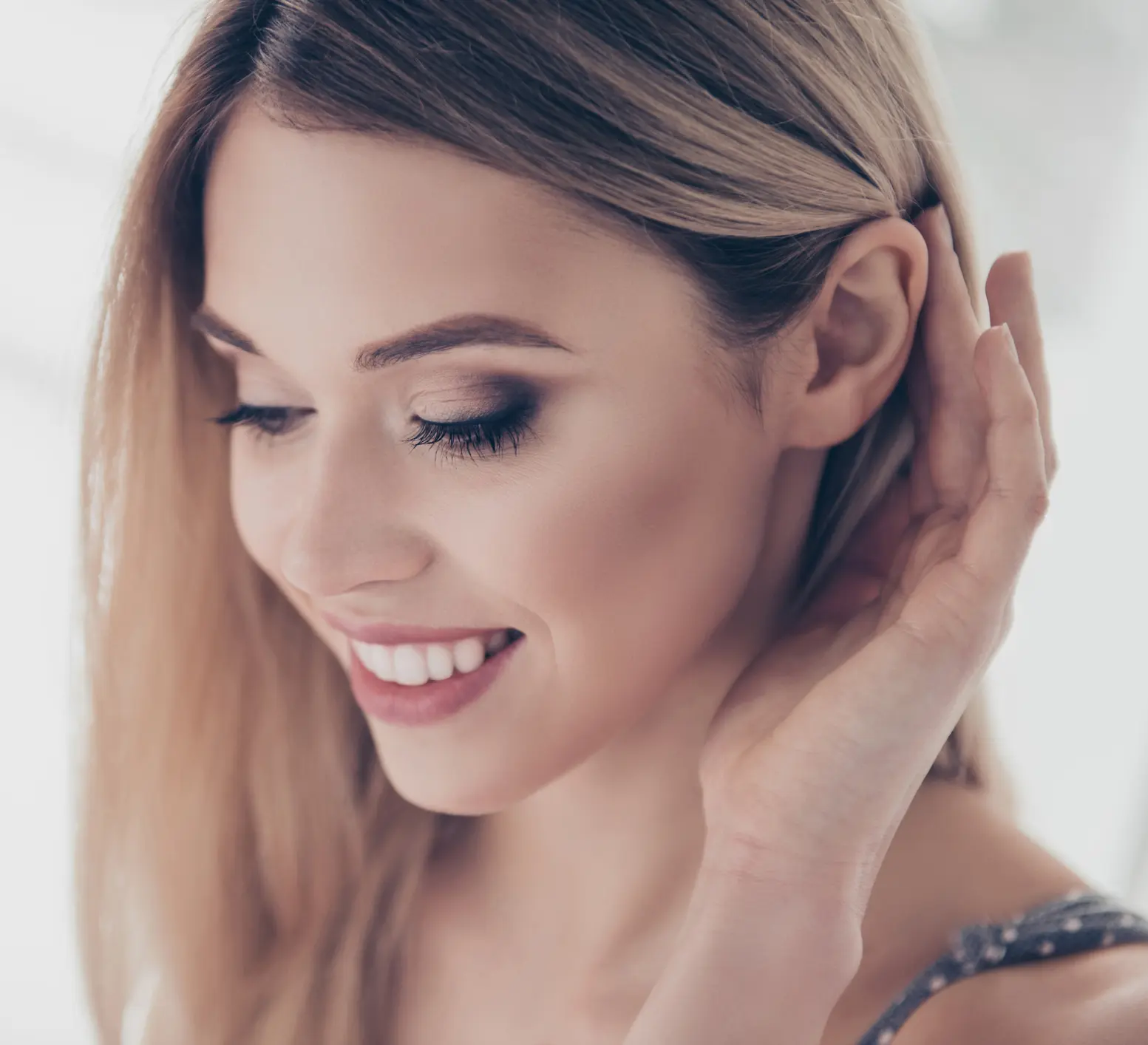 Close up portrait of successful, pretty, charming, gorgeous, cheerful, cute, modern, naked, nude, natural, positive, correcting her hair behind ear, skincare, bodycare, healthcare concept Cosmetic Breast Surgery and Enhancement in Daytona Beach, FL